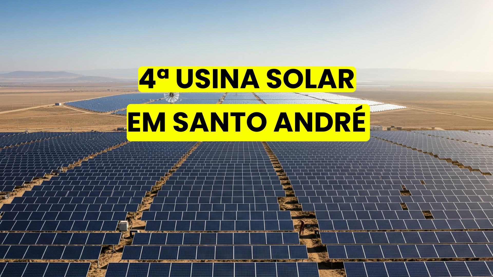 Imagem panorâmica de uma usina solar em Santo André, com dezenas de painéis solares alinhados em um terreno plano, tendo ao fundo montanhas secas sob céu limpo. Texto sobreposto anuncia a inauguração da 4ª usina solar na cidade.