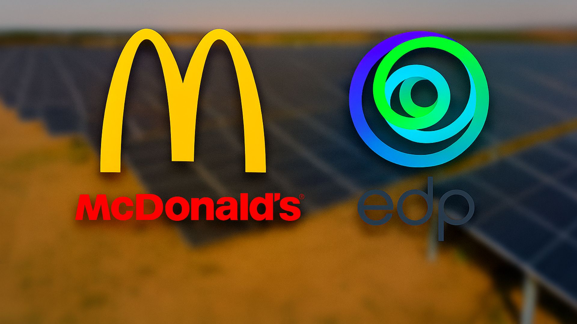 Imagem aérea desfocada de uma usina solar com os logotipos da EDP e McDonald’s centralizados em destaque.
