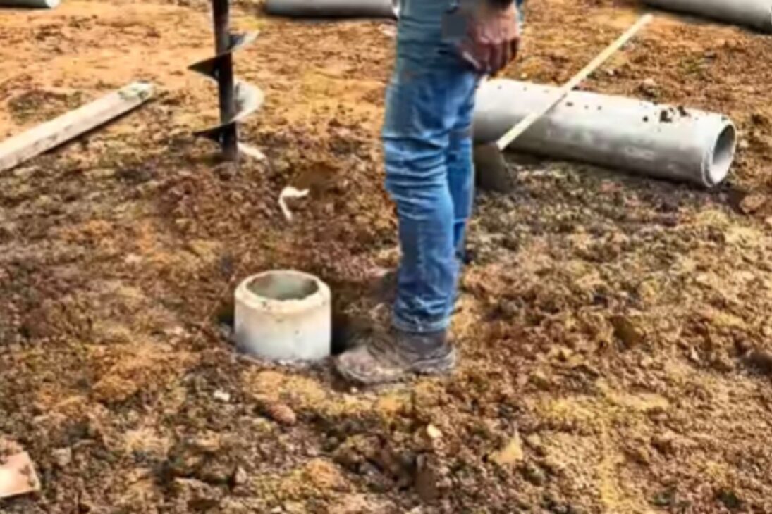 Carpenter Uses Concrete Pipes And Compacted Gravel In The Wooden House With Pilotis-Type Pillars And Shows Fast Foundation.