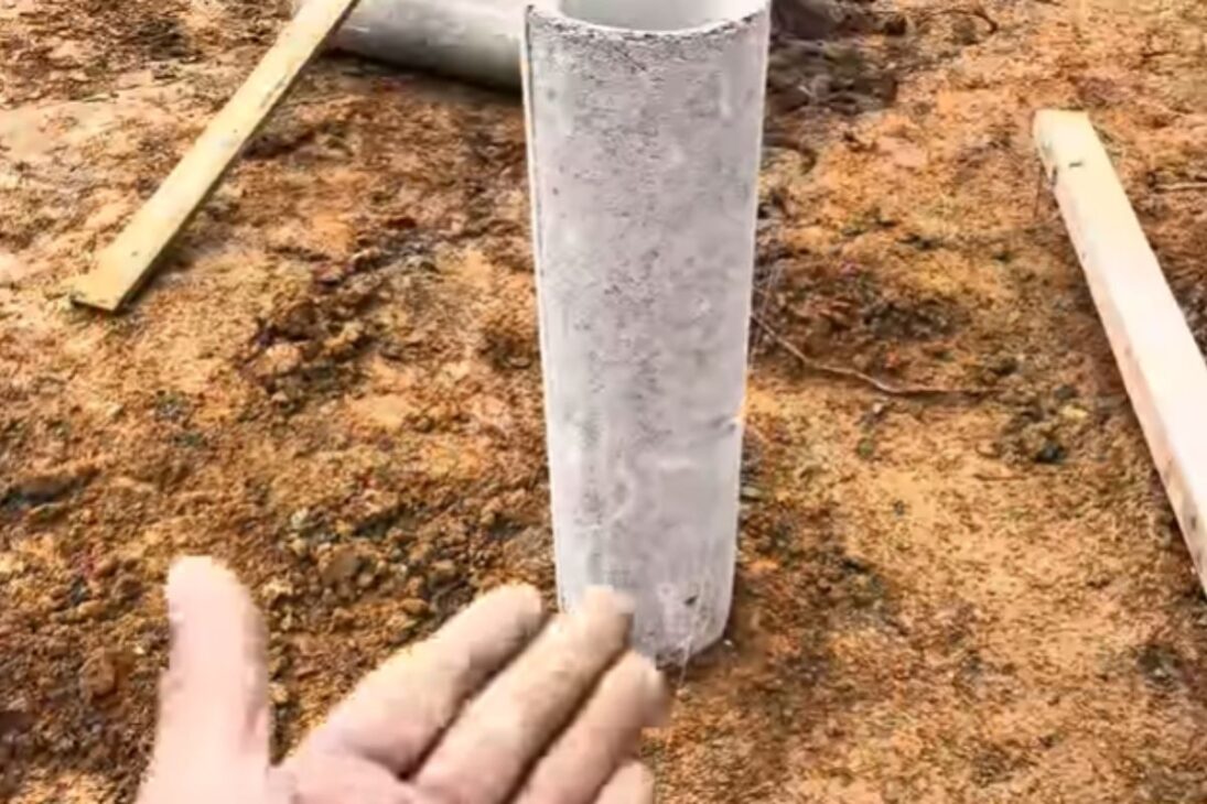 Carpenter Uses Concrete Pipes And Compacted Gravel In The Wooden House With Pilotis-Type Pillars And Shows Fast Foundation.