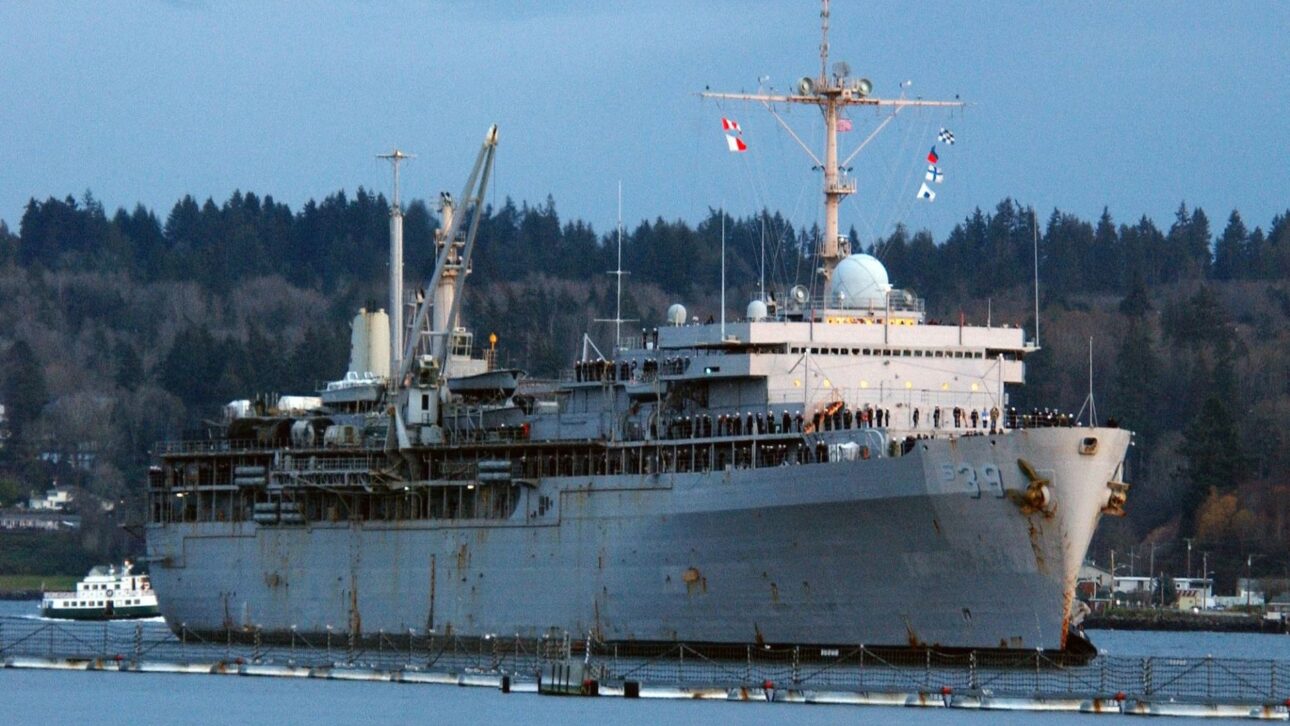 USS Emory S. Land: a workshop ship that keeps U.S. nuclear submarines operating away from shipyards and sustains naval presence in the Indo-Pacific.
