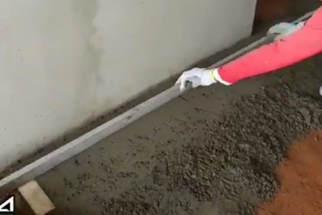 Mason teaches floor leveling with a level, ruler, and well-defined slope to avoid water pooling and unevenness.