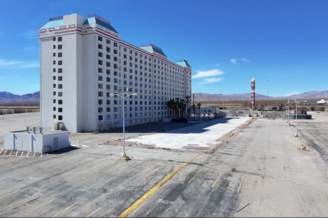 giant casino in Jean, Nevada, remains empty by the highway as the abandoned hotel waits for a demolition stalled by a weak market and frozen industrial plans.